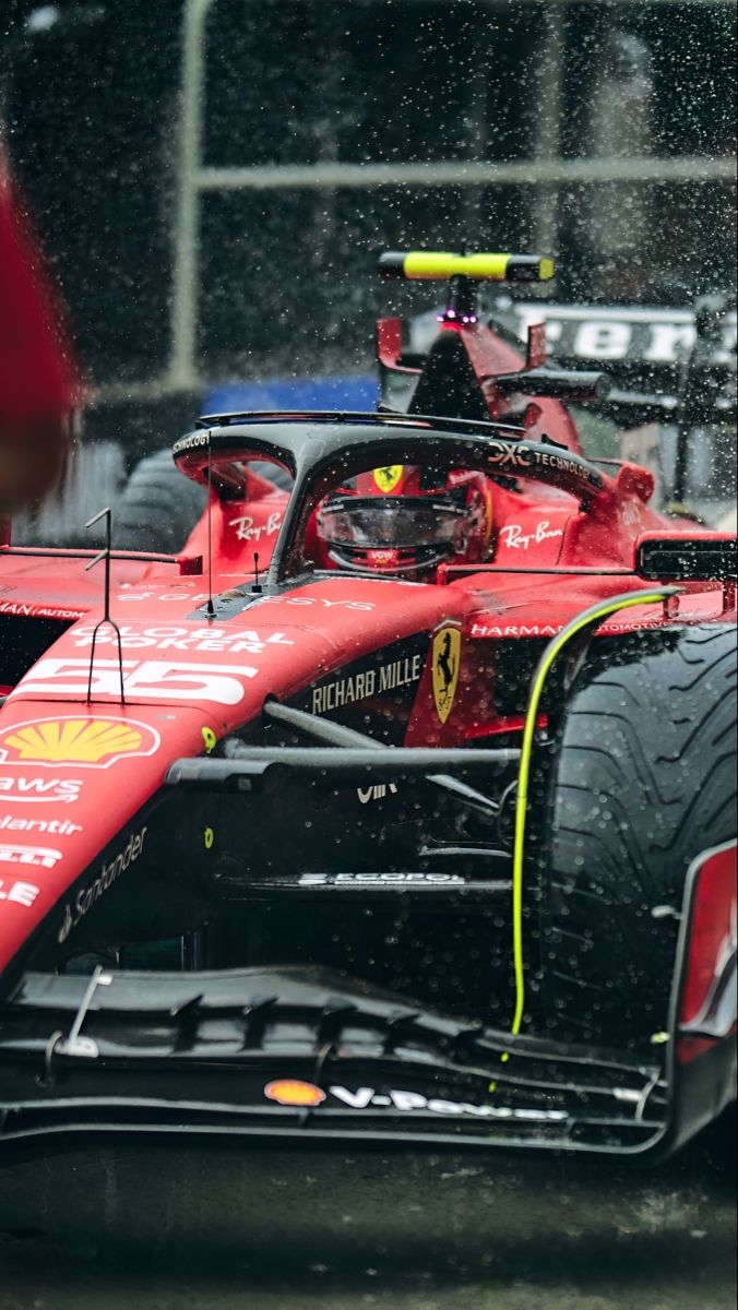 Ferrari F1 75 phone wallpaper - in the rain in a city 676x1200